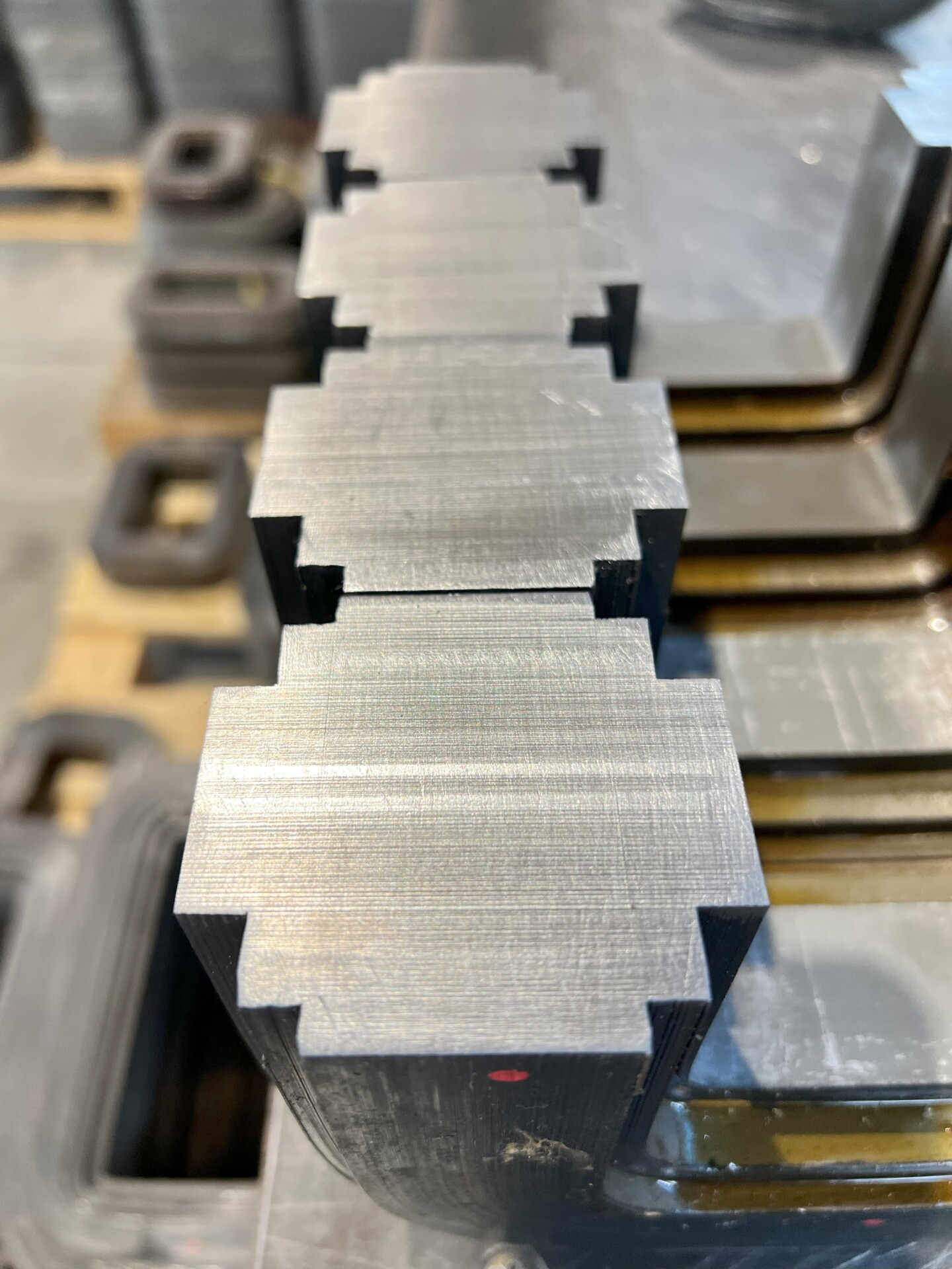 Metal C cores with precise slots for assembly in electrical devices